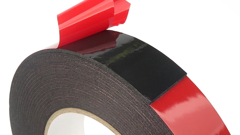 PE foam tape roll showing polyethylene foam backing and adhesive layer PE foam tape roll showing polyethylene foam backing and adhesive layer